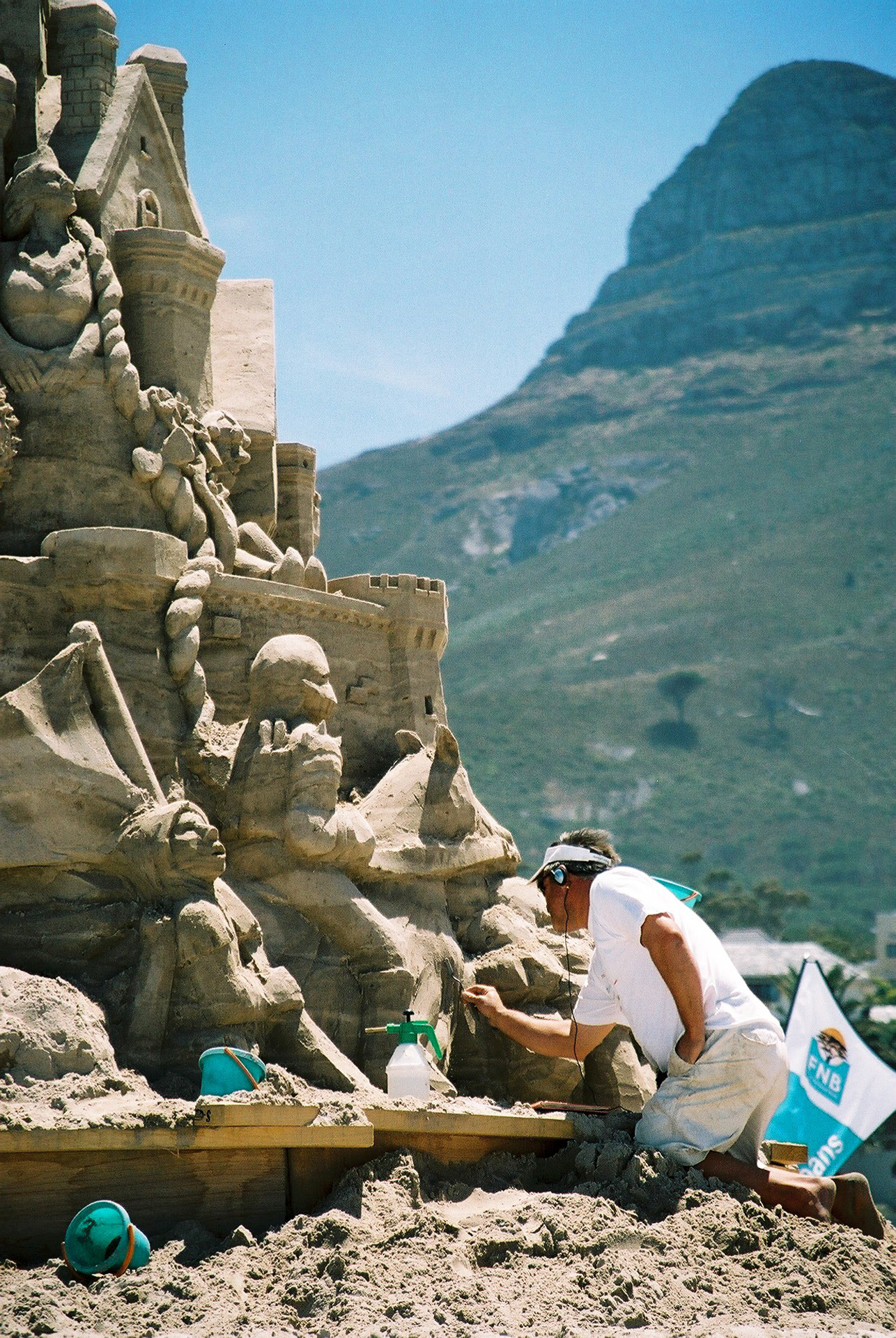 Artists Sculpting Giant Pile of Sand Into Largest Sandcastle